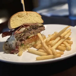 Mushroom burger -sautéed mushrooms &amp; onions w/ Swiss cheese &amp; added bacon. I was going to share, so they served on 2 separate plates for us