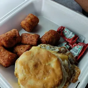 Egg bacon biscuit and loaded tatter tots.