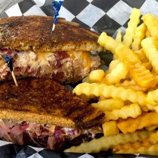Reuben - Flat grilled corned beef topped with kraut, red cabbage, cheese, Thousand island dressing on toasted marble rye.