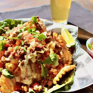 a plate of food and a glass of beer