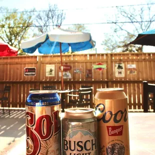 three cans of beer on a table