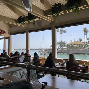 people sitting at tables in a restaurant