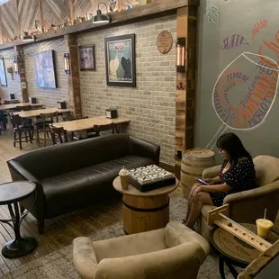 The comfortable area with board games and couches.