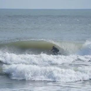 Frank the owner surfing Bob Hall Pier