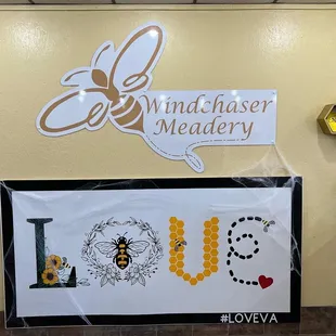 a picture of a sign with a bee on it