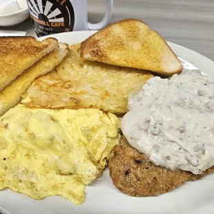 Country fried steak with white toast, hashbrowns and scrambled eggs