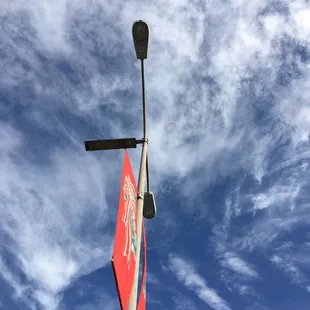 a street light and a red flag