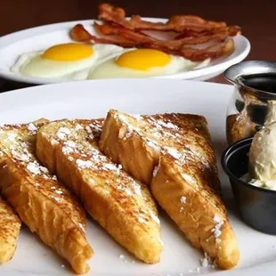 a plate of french toast and eggs