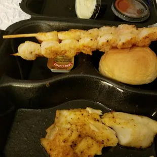 Seafood trio, 2shrimp skewers one tilapia. Tasted good but the amount of food was scanty