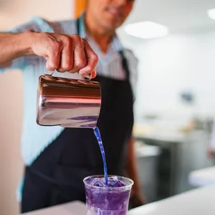a bartender pouring a drink