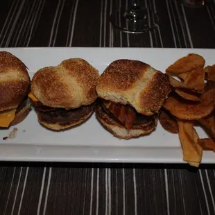 a plate of hamburgers and french fries