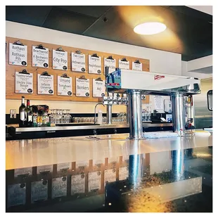 a bar with a lot of signs on the wall