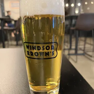 a glass of beer on a table