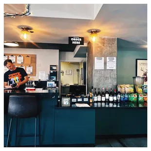 a man standing at the bar