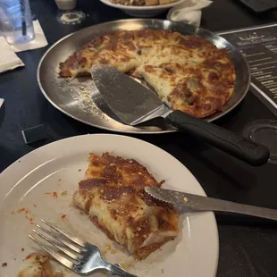 Delicious meats medium pizza and Caesar salad