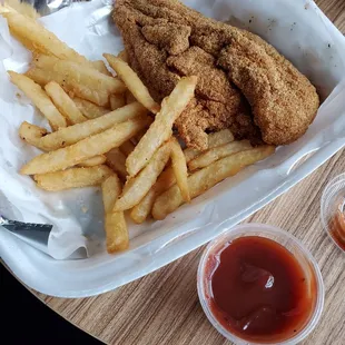 a basket of fried chicken and french fries