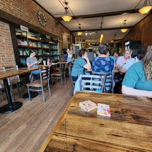 people sitting at tables and eating