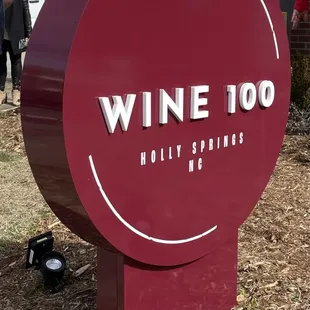 a sign for a winery in front of a building