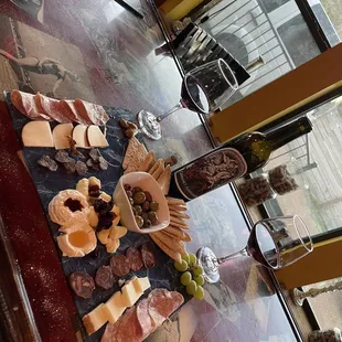 Charcuterie board and a bottle of the Wine Wednesday special Cabernet Sauvignon