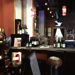 a bar with a lot of bottles of wine