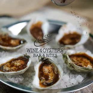 Pomegranate reduction oysters on half shell