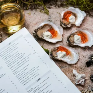 Red salmon caviar oysters on half shell