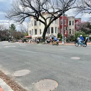 a group of people riding bicycles
