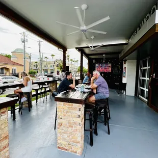a group of people sitting at a bar