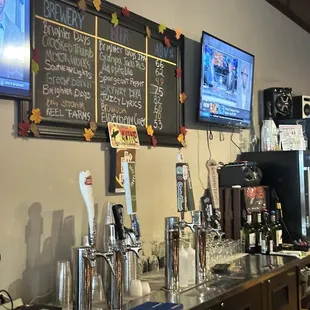a bar with menus on the wall