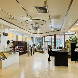 a woman standing in a wine shop