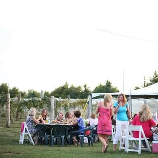 a group of people sitting around a table