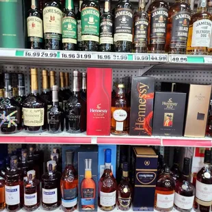 a shelf of liquor bottles
