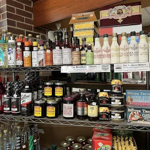 a shelf of liquor and condiments