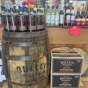 a barrel of bourbon and bottles of bourbon