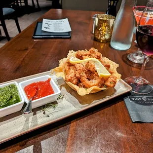 a plate of food and a glass of wine