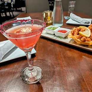 a glass of wine and a plate of food