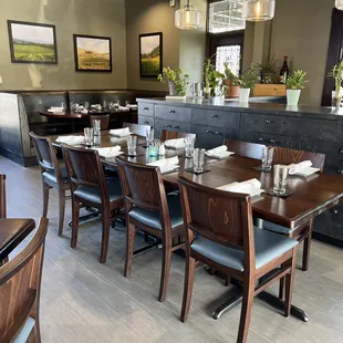 a dining room with tables and chairs
