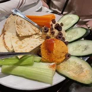 a plate of food with a variety of vegetables