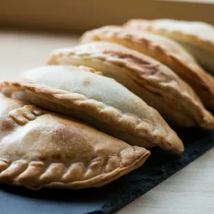 They have 3 kinds of empanadas: caprese, spinach &amp; feta, mushroom &amp; gorgonzola. Comes with chimichuri on the side.