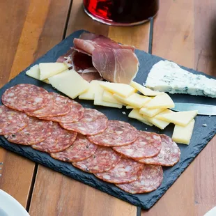 Cheese &amp; meat feast: prosciutto, salami, blue cheese, white cheddar. Served with flatbread.