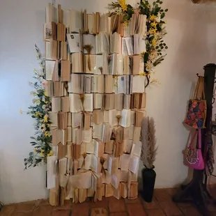 a wall of books stacked on top of each other