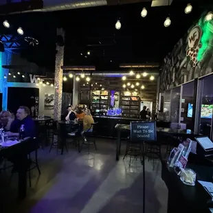 people sitting at the bar