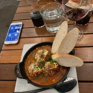 a plate of food and a glass of wine
