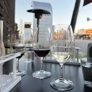 a row of wine glasses on a table