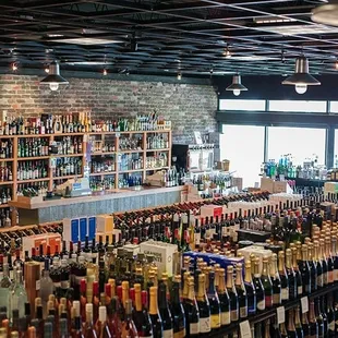 rows of bottles of wine on shelves