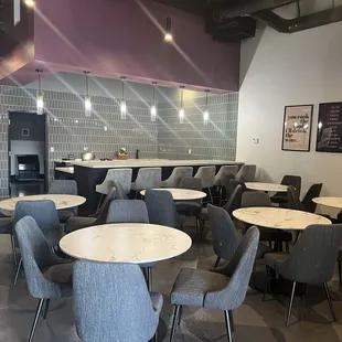 a restaurant with tables and chairs