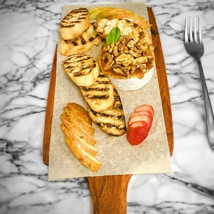 Baked Brie, fig jam, walnuts, fresh apple, grilled baguette