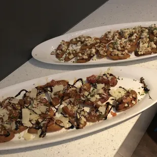 two plates of appetizers