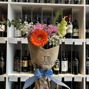 a person holding a bunch of flowers