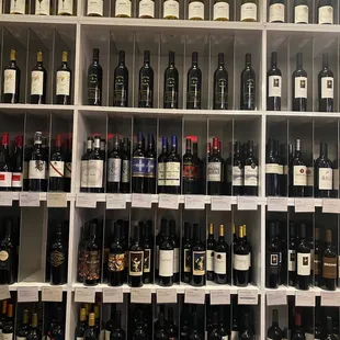 rows of wine bottles on shelves